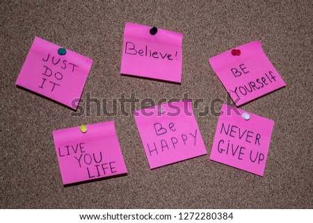 Pink sticky notes on cork board background and text concept free consultation