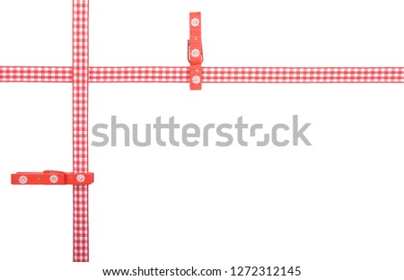 Red-white checked ribbon with clothespins