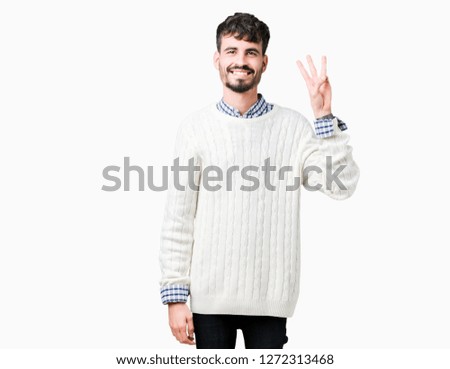 Young handsome man wearing winter sweater over isolated background showing and pointing up with fingers number three while smiling confident and happy.