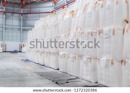 Stacking of bulk cargo in jumbo bags are store in warehouse for distribution to customer, import export logistics business.