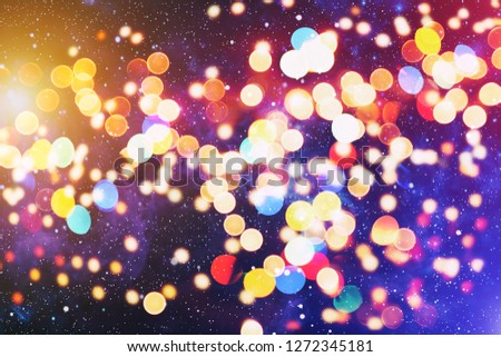 Christmas light background. Holiday glowing backdrop. Defocused Background With Blinking Stars. Blurred Bokeh. 