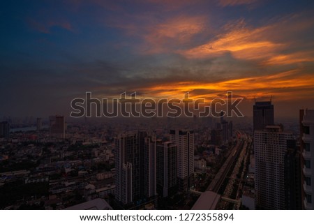 skyline of twilight time with cityscape of downtown  and railway sky train