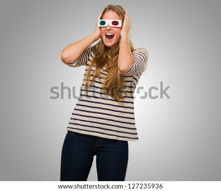 Young Woman Wearing 3d Glasses against a grey background