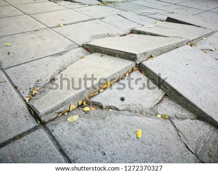 broken concrete pathway brick surface background, close up abstract cracked cement block texture Royalty-Free Stock Photo #1272370327