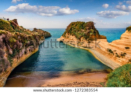 Wonderful spring view of famous Channel Of Love (Canal d'Amour) beach. Bright morning seascape of Ionian Sea. Amazing outdoor scene of Corfu Island, Greece, Europe.  Royalty-Free Stock Photo #1272383554