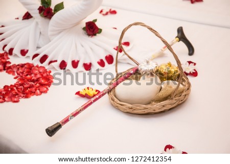 Misty cat statue, silver and gold vegetable statue On beds and accessories in the wedding ceremony (Thai) and walking sticks, beautiful flower petals In the wedding ceremony
