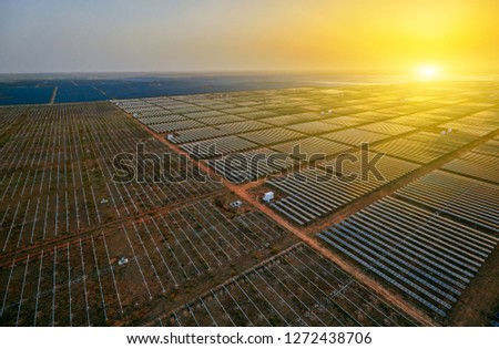 Aerial solar photovoltaic panels at sunset
