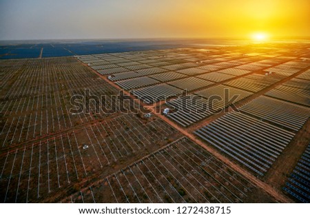 Aerial solar photovoltaic panels at sunset