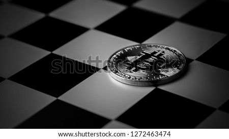 bitcoins on chess board in the dark. - business and economy in the future concept.