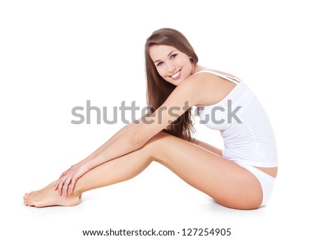 Attractive young woman in white underwear. All on white background.