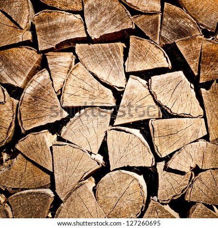 fire wood background texture. closeup of chopped fire wood stack Royalty-Free Stock Photo #127260695