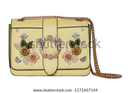 Fashionable yellow female luxury women bag isolated on a white background. Fashionable womans accessories.