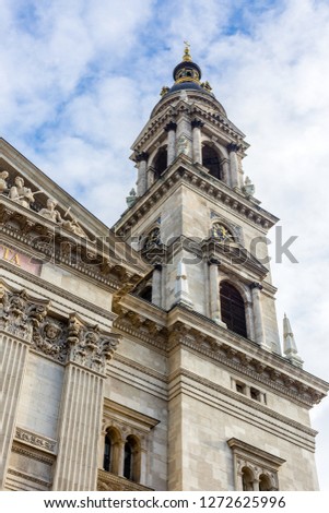 Fragment of facade of Saint Stephen Basilica, bell tower with a clock. St. Stephen Basilica - largest roman catholic church in Budapest, Hungary
