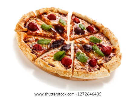 Pizza with plums and strawberries on white background
