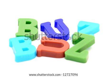 Close-up of letters. "Buzz" word.