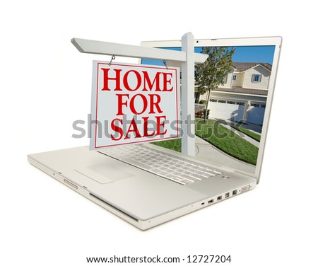 Home for Sale Sign & New Home on Laptop isolated on a white Background.