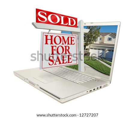 Sold Home for Sale Sign & New Home on Laptop isolated on a white Background.