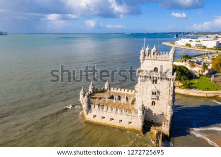 Aerial drone panorama photo of the Belem Tower (Belém Tower) at sunset. A medieval castle fortification on the Tagus river of Lisbon Portugal