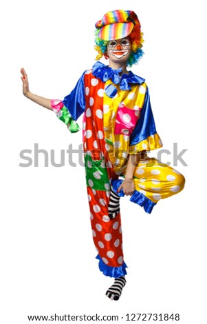 Clown raises one hand and one leg. Isolated background.