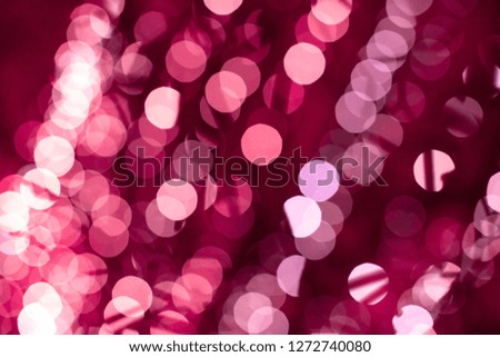 Pink bokeh blurred lights background. Rose garlands decoration for the new year festival celebration.