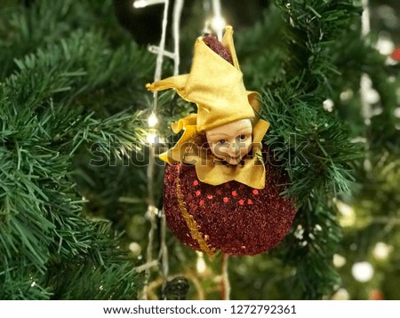 Christmas doll on Christmas tree background