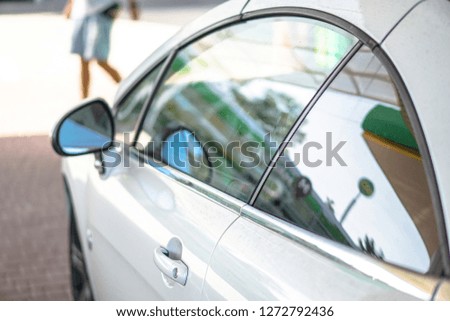 Car on the road. Transport and its doors and reflection in glass. Stock photos for design