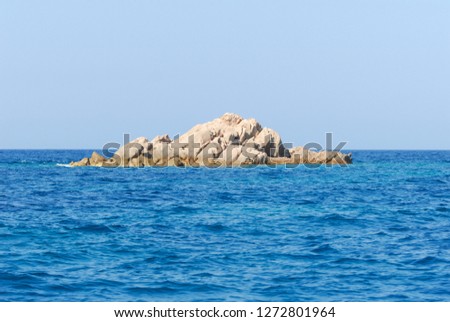 Red granite rocks in the middle of the sea of Costa Smeralda, Sardinia, Italy