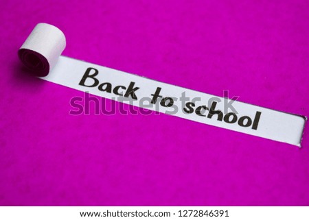 Back to School text, Inspiration, Motivation and business concept on purple torn paper