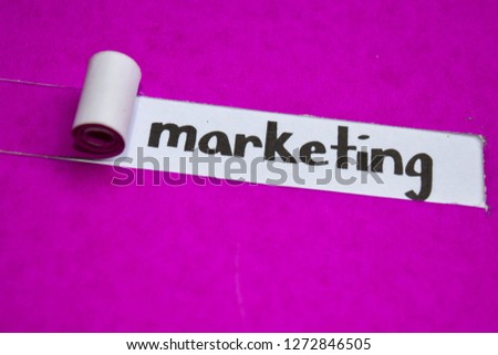 Marketing text, Inspiration, Motivation and business concept on purple torn paper