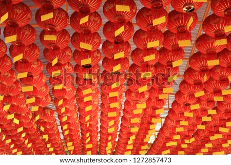 Chinese lanterns hanging on the roof decoration at chinese shrine traditional. Chinese new year culture background. (Foreign text means blessing and lucky and wealth)