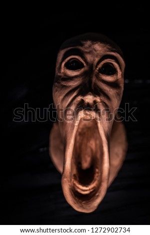Image of a panicked face screaming in fear. Picture of dread, halloween or day of the dead. halloween 2019, concept of terrified or something macro.
