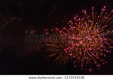 Amazing red fireworks on dark sky