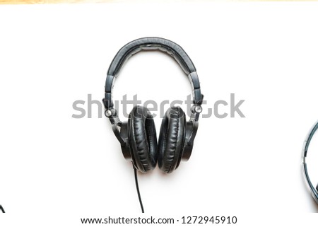 old used headphones isolated on white background
