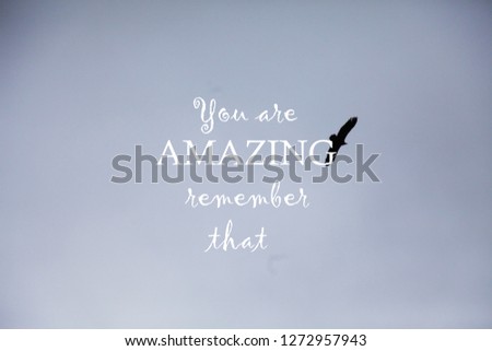 Blurry sky and clouds with Inspirational quote -You are amazing remember that