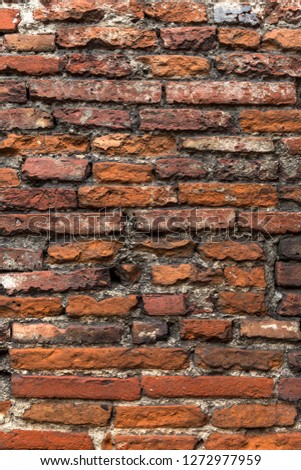 Old orange brick wall, close up.