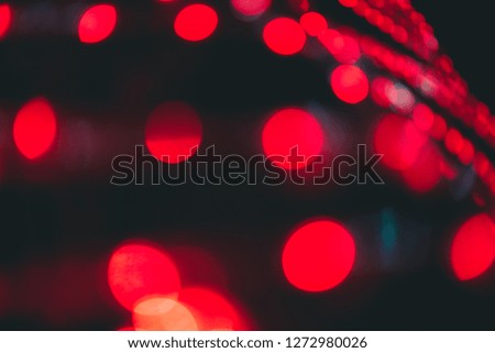 Abstract light bokeh Red glitter light of city in night celebration on black background