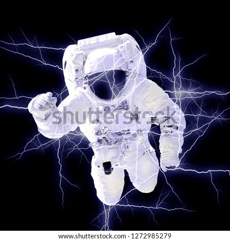 Astronaut in spacesuit close up in electrical flashes. Spaceman in outer space. Mixed media