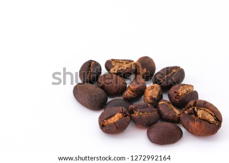 Coffee beans background texture isolated on white background with copy space for text. Royalty high-quality free stock macro photo image roasted brown, black coffee bean isolated on white background
