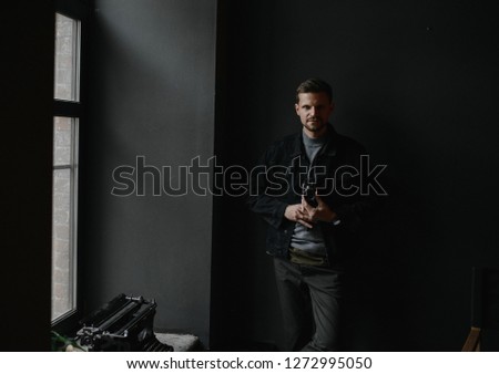 business portrait. Man shoots an old video camera