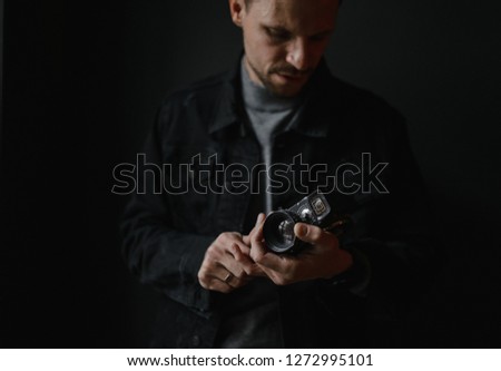 business portrait. Man shoots an old video camera