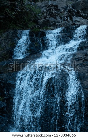 Thac Bac or Silver waterfall on mountain in Sapa Vietnam . close up waters and stone . tropical view on hill .