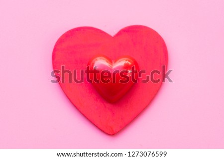 Red heart and paper heart on pink background.Lover and Valentines day concept.