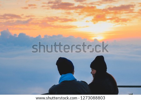 Couple standing amidst the mountains.traveling concept.