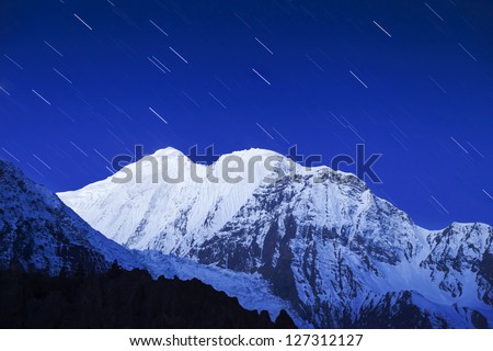 Mountain and star trails on the night sky