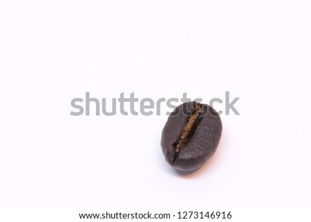 A coffee bean background texture isolated on white background with copy space for text. Royalty high-quality free stock macro photo image roasted brown, black coffee bean isolated on white background