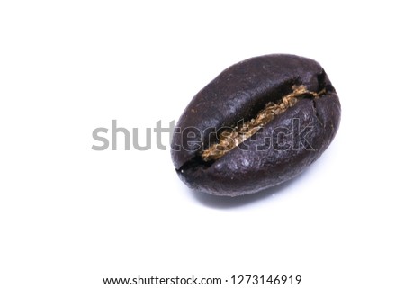 A coffee bean background texture isolated on white background with copy space for text. Royalty high-quality free stock macro photo image roasted brown, black coffee bean isolated on white background