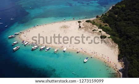 Aerial drone photo of tropical island paradise bay with turquoise clear sea and sandy beach