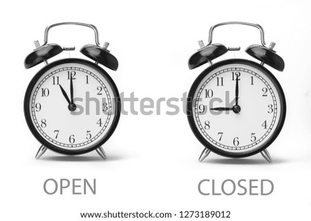 Sign showing business opening hours Black and white image Isolated on white background Close-up