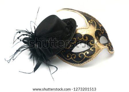 Black and gold carnival venetian mask and black woman hat with feathers and black lace on white background
