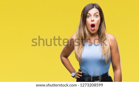 Young beautiful elegant business woman over isolated background afraid and shocked with surprise expression, fear and excited face.